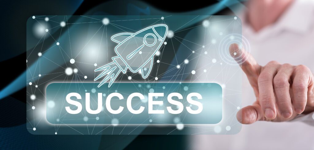 A man pointing his fingers on air with a digital holographic image of a rocket and text "success".